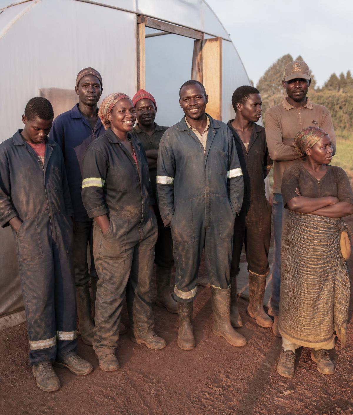 Malawi CannaGrow farm team standing outside a greenhouse